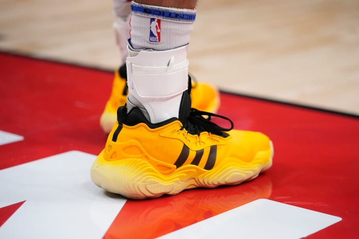 Atlanta Hawks guard Trae Young's yellow and black adidas sneakers.